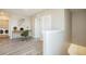 Upstairs loft area with desk and laundry room access with view of downstairs stairway at 129 Eagleview Loop, Davenport, FL 33837