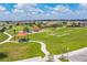 Community playground with slides, picnic tables, and lush green spaces for outdoor activities at 129 Eagleview Loop, Davenport, FL 33837