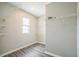 A walk-in closet equipped with adjustable shelves and a window for natural light at 129 Eagleview Loop, Davenport, FL 33837