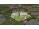 Aerial view of multi-Gathering residential buildings with beautiful landscaping and surrounding neighborhood at 1321 Arbor Vista Loop # 301, Lake Mary, FL 32746