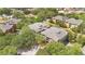 Aerial view of apartment buildings surrounded by lush, mature trees at 1321 Arbor Vista Loop # 301, Lake Mary, FL 32746