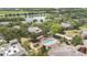 Overhead view of a community pool, nearby lake, and surrounding neighborhood at 1321 Arbor Vista Loop # 301, Lake Mary, FL 32746