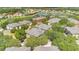 Aerial view of multi-Gathering residential buildings with lake in the background and mature landscaping at 1321 Arbor Vista Loop # 301, Lake Mary, FL 32746