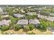 Scenic aerial view of apartments in a community surrounded by trees and landscaping at 1321 Arbor Vista Loop # 301, Lake Mary, FL 32746