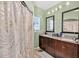 Bathroom featuring a shower with patterned curtains and a vanity with dual sinks at 1321 Arbor Vista Loop # 301, Lake Mary, FL 32746