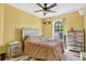 Bedroom featuring a queen bed, neutral colored walls, a ceiling fan, and a window at 1321 Arbor Vista Loop # 301, Lake Mary, FL 32746