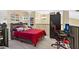 Lofted bedroom features a bed, a ceiling fan, and unique license plate wall decor at 1321 Arbor Vista Loop # 301, Lake Mary, FL 32746