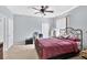 Cozy bedroom with natural light, a ceiling fan, and neutral walls at 1321 Arbor Vista Loop # 301, Lake Mary, FL 32746