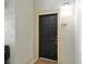 Apartment entrance with a black door and a 'Welcome' mat at 1321 Arbor Vista Loop # 301, Lake Mary, FL 32746