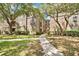 Apartment complex with landscaped grounds and walkway leading to entrance at 1321 Arbor Vista Loop # 301, Lake Mary, FL 32746