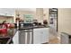 Bright kitchen featuring stainless steel appliances, dark countertops, and a breakfast bar area at 1321 Arbor Vista Loop # 301, Lake Mary, FL 32746