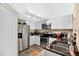 Modern kitchen with stainless steel appliances, granite countertops, and white cabinets at 1321 Arbor Vista Loop # 301, Lake Mary, FL 32746