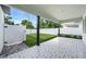 A covered back patio overlooking a fenced-in yard at 1414 W New Hampshire St, Orlando, FL 32804