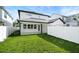 A spacious backyard with white fence and manicured lawn at 1414 W New Hampshire St, Orlando, FL 32804