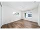 A modern bedroom with wood flooring, a ceiling fan, and bright natural light at 1414 W New Hampshire St, Orlando, FL 32804