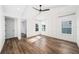 Bright bedroom features hardwood floors, a ceiling fan, and ample natural light from multiple windows at 1414 W New Hampshire St, Orlando, FL 32804