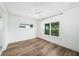 Bright bedroom with hardwood floors and large windows offering views of the surrounding landscape at 1414 W New Hampshire St, Orlando, FL 32804