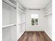 Spacious walk-in closet with custom shelving and ample storage space with a window view at 1414 W New Hampshire St, Orlando, FL 32804