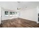 Bright living room featuring hardwood floors, a ceiling fan, and large windows providing ample natural light at 1414 W New Hampshire St, Orlando, FL 32804