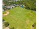 Aerial view of the sports fields including baseball field, soccer field, tennis and basketball courts, perfect for community activities at 14306 Paradise Tree Dr, Orlando, FL 32828