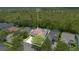 Aerial shot of a property surrounded by lush greenery, showcasing its position in a serene, wooded area at 14306 Paradise Tree Dr, Orlando, FL 32828
