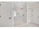 Bathroom showcasing a glass enclosed walk-in shower with white tile and a built-in niche at 14306 Paradise Tree Dr, Orlando, FL 32828