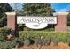 Elegant stone entrance sign for Avalon Park community surrounded by manicured landscaping and greenery at 14306 Paradise Tree Dr, Orlando, FL 32828