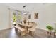 Dining room featuring a wooden table, bench, chairs, and natural light at 14306 Paradise Tree Dr, Orlando, FL 32828