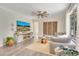 Comfortable living room with hardwood floors, a large sectional sofa, and a decorative accent wall at 14306 Paradise Tree Dr, Orlando, FL 32828