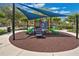 Community playground with shade structure, slides, and climbing features for outdoor fun at 14306 Paradise Tree Dr, Orlando, FL 32828