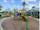 Colorful playground featuring slides, climbing structures, and a soft play surface, creating a fun and safe recreational area at 14306 Paradise Tree Dr, Orlando, FL 32828