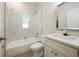 Bathroom with marble tiling in the shower and a quartz countertop at 144 Mandrake St, Orlando, FL 32811