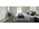 Modern bedroom featuring neutral tones, a large window, and stylish decor, offering a serene and inviting atmosphere at 144 Mandrake St, Orlando, FL 32811