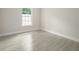 Bright bedroom with tile floors and a large window at 144 Mandrake St, Orlando, FL 32811