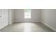 Bedroom with tile flooring and a bright window at 144 Mandrake St, Orlando, FL 32811