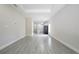 Open-concept living space featuring tile floors, recessed lighting, and modern finishes and flows into kitchen at 144 Mandrake St, Orlando, FL 32811
