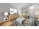 Bright and airy living room with neutral walls, contemporary furniture, and stylish decor, perfect for relaxation and gatherings at 144 Mandrake St, Orlando, FL 32811