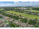 Expansive aerial view of a golf course community with well-manicured greens and scenic views at 15038 Masthead Landing Cir, Winter Garden, FL 34787