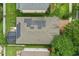 Aerial view of a home with solar panels, a screened patio, and a well-maintained yard at 15038 Masthead Landing Cir, Winter Garden, FL 34787