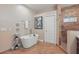 Elegant bathroom features a soaking tub and separate shower with beautiful tile at 15038 Masthead Landing Cir, Winter Garden, FL 34787
