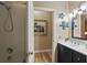 Bathroom featuring a shower and vanity with double sinks at 15038 Masthead Landing Cir, Winter Garden, FL 34787