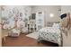 Charming bedroom with a tree mural, natural light, and comfortable bed at 15038 Masthead Landing Cir, Winter Garden, FL 34787