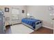 Cozy bedroom with hardwood floors, a window, and a comfortable single bed at 15038 Masthead Landing Cir, Winter Garden, FL 34787