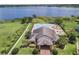 Aerial view of the Sunnybrook West community clubhouse with a pool, spa, and beautiful landscaping near the lake at 15038 Masthead Landing Cir, Winter Garden, FL 34787