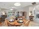 Dining area with a view of the living room with sliding glass doors to the fenced backyard and patio at 15038 Masthead Landing Cir, Winter Garden, FL 34787