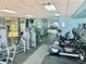 Community gym with cardio machines, weightlifting equipment, and mirrors, offering a variety of workout options at 15038 Masthead Landing Cir, Winter Garden, FL 34787