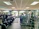 Large community gym overlooking the lake features cardio machines, weightlifting equipment, and scenic views at 15038 Masthead Landing Cir, Winter Garden, FL 34787