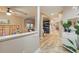 Inviting hallway featuring elegant flooring, archways, and neutral-toned walls and a view of the rooms beyond at 15038 Masthead Landing Cir, Winter Garden, FL 34787