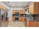 Well-equipped kitchen features stainless steel appliances, granite countertops, and light wood cabinetry at 15038 Masthead Landing Cir, Winter Garden, FL 34787