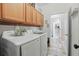 Functional laundry room with ample cabinet space and modern appliances at 15038 Masthead Landing Cir, Winter Garden, FL 34787